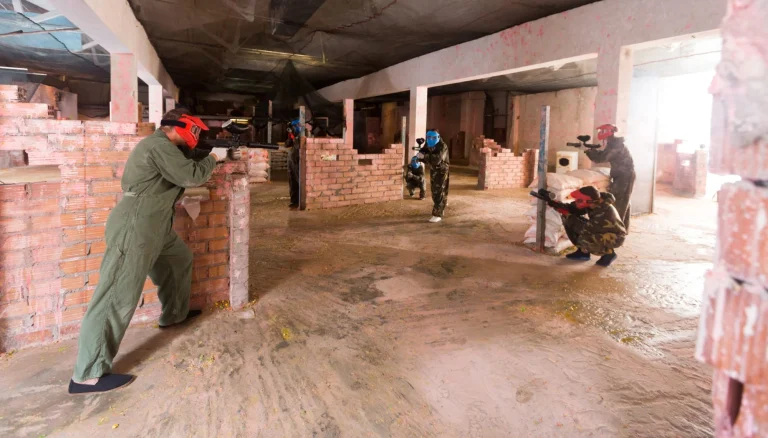 group playing paintball